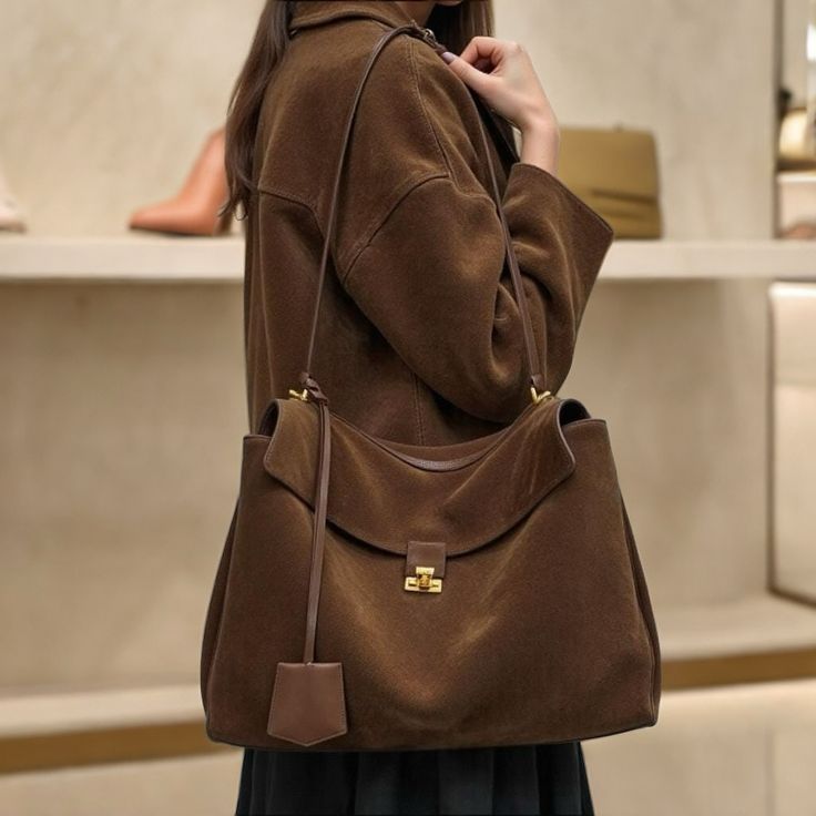 The_rich_suede_and_timeless_design_make_it_the_perfect_statement_piece_for_any_wardrobe__Grab_yours_before_it_s_gone_LimitedEdition_MustHaveBag_StyleUpgrade_FashionForward_GrabYoursNo.jpg